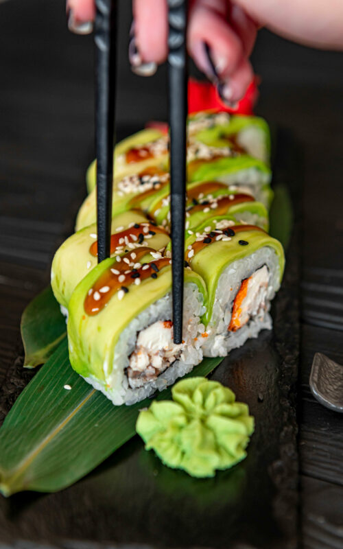 sushi-roll-with-smoked-eel-unagi-covered-by-avocado-sesame-seeds
