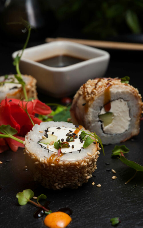 sushi-rolls-with-eel-cream-cheese-cucumber-sesame